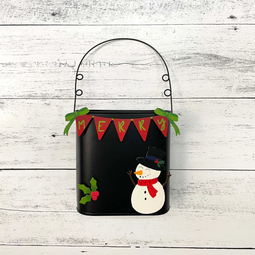 Cheery Snowman magnet on a black display with holly and "Merry" magnet