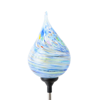 Tear drop glass orb with blue, white, red, yellow, green, pink and copper glass swirled around the surface. There is a black clip at the base. Displayed on a transparent background.