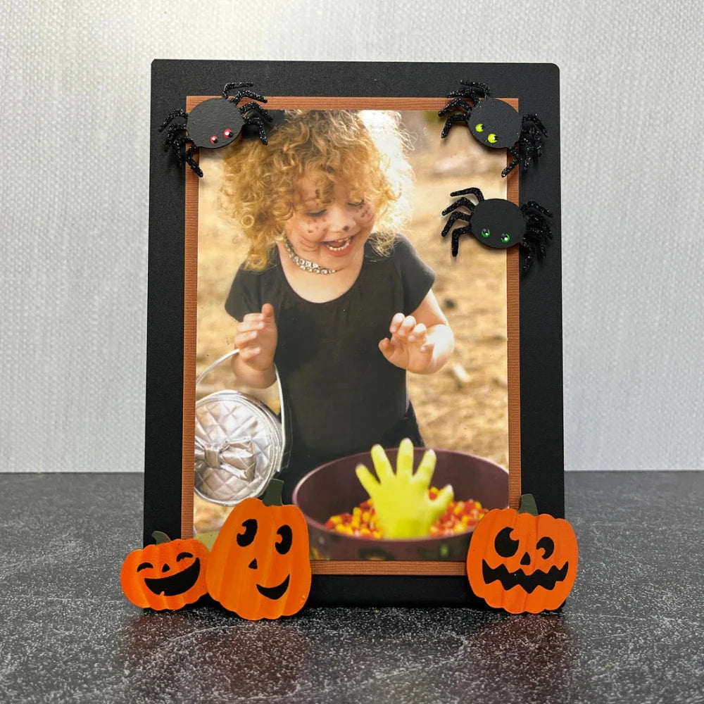 Magnetic Photo Easel with a Halloween photo and Halloween magnets